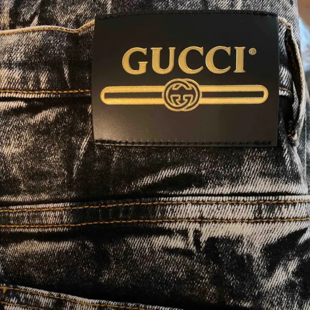 Gucci size 26 acid-washed jeans